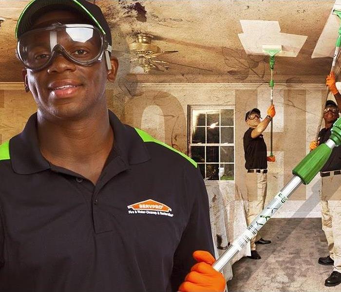 image of SERVPRO technician restoring on various aspects of fire damaged home